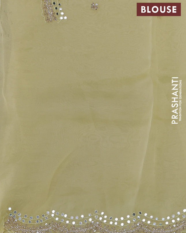 Pure organza silk saree pale yellow with allover zari weaves and sequin mirror work border