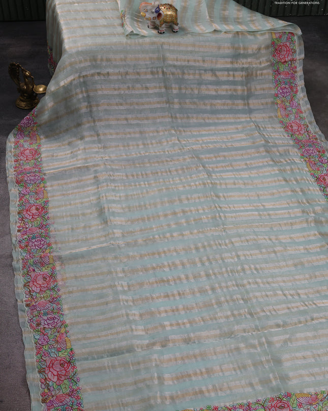 Pure organza silk saree pastel green with allover silver & zari stripes pattern and floral embroidery border