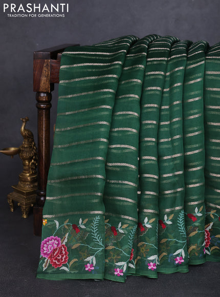 Pure organza silk saree bottle green with allover zari weaves and floral embroidery border