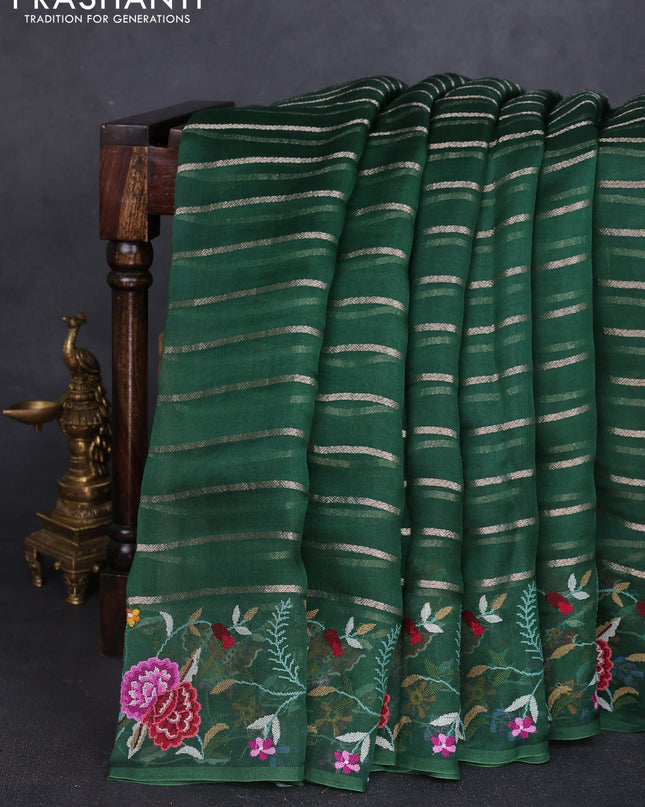 Pure organza silk saree bottle green with allover zari weaves and floral embroidery border