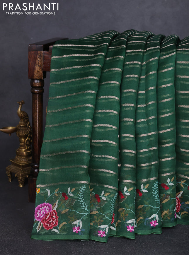 Pure organza silk saree bottle green with allover zari weaves and floral embroidery border