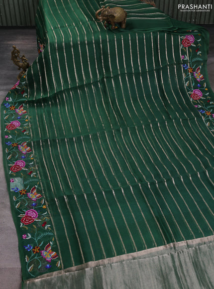 Pure organza silk saree bottle green with allover zari weaves and floral embroidery border