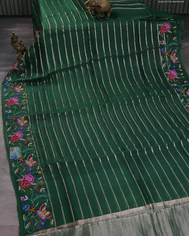 Pure organza silk saree bottle green with allover zari weaves and floral embroidery border