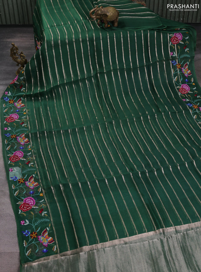 Pure organza silk saree bottle green with allover zari weaves and floral embroidery border