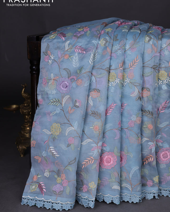 Pure organza silk saree blue shade with floral embroidery work and lace work border