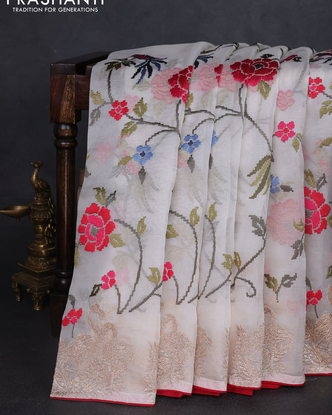 Pure organza silk saree off white and red with allover embroidery work and embroidery butta border