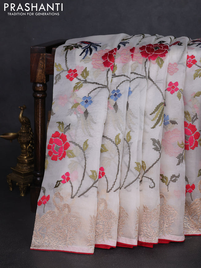 Pure organza silk saree off white and red with allover embroidery work and embroidery butta border