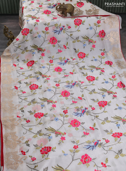 Pure organza silk saree off white and red with allover embroidery work and embroidery butta border