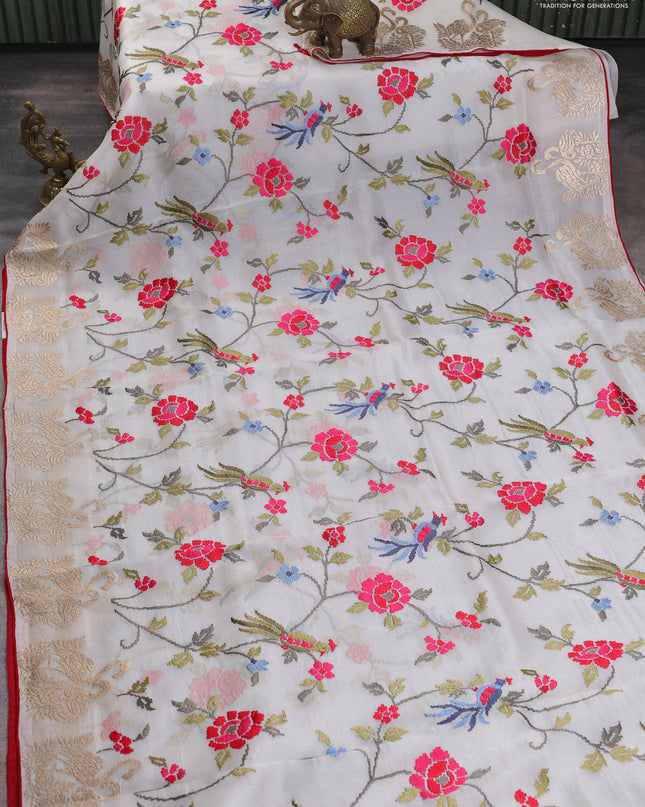 Pure organza silk saree off white and red with allover embroidery work and embroidery butta border