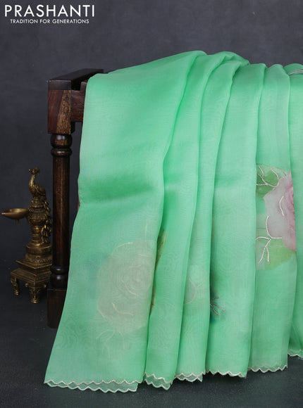 Pure organza silk saree light green with floral embroidery buttas and floral embroidery border
