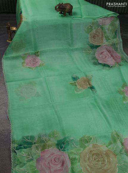 Pure organza silk saree light green with floral embroidery buttas and floral embroidery border