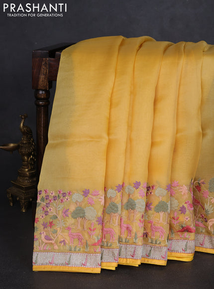 Pure organza silk saree yellow with plain body and embroidery work border