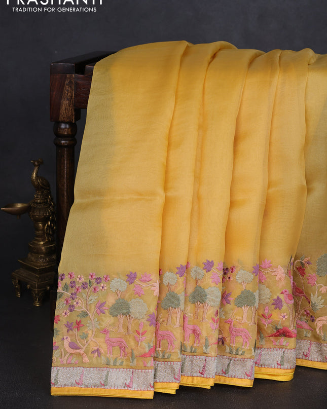 Pure organza silk saree yellow with plain body and embroidery work border
