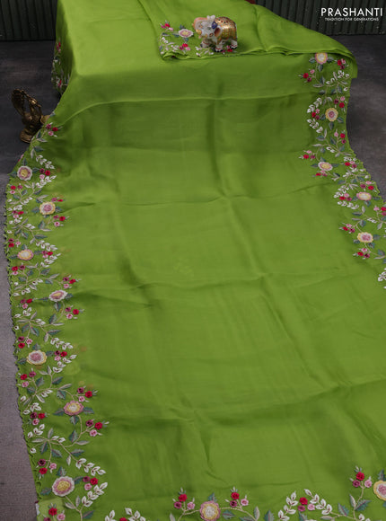 Pure organza silk saree parrot green with plain body and floral embroidery border
