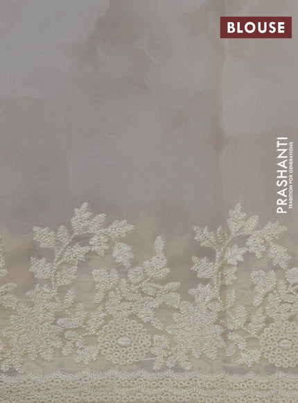 Pure organza silk saree cream with floral prints and floral embroidery border