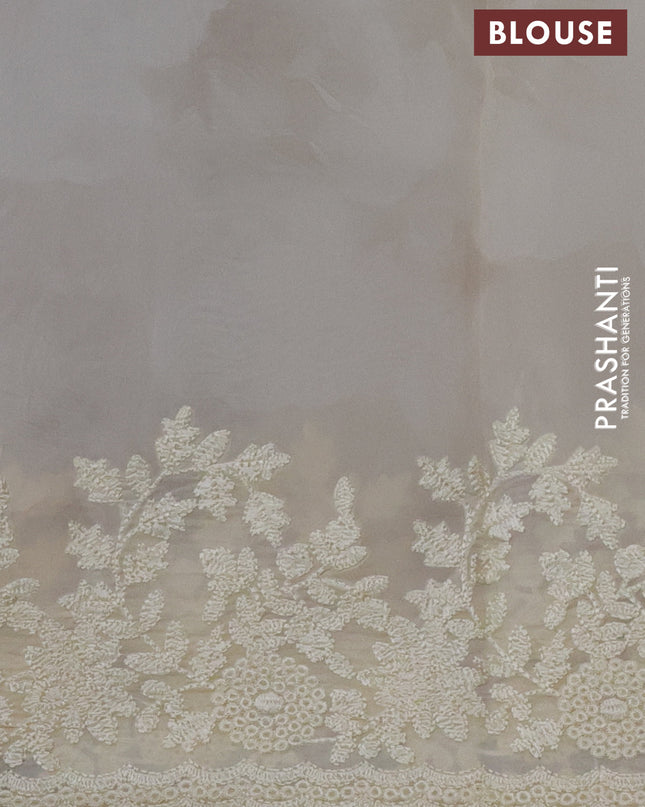 Pure organza silk saree cream with floral prints and floral embroidery border
