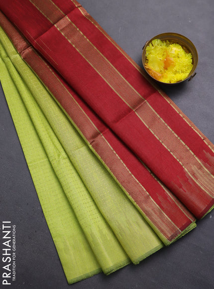 Semi dupion saree fluorescent green and maroon with allover zari weaves and temple zari woven border