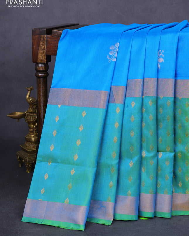 Pure uppada silk saree cs blue and dual shade of teal green with silver zari woven floral buttas and zari woven butta border