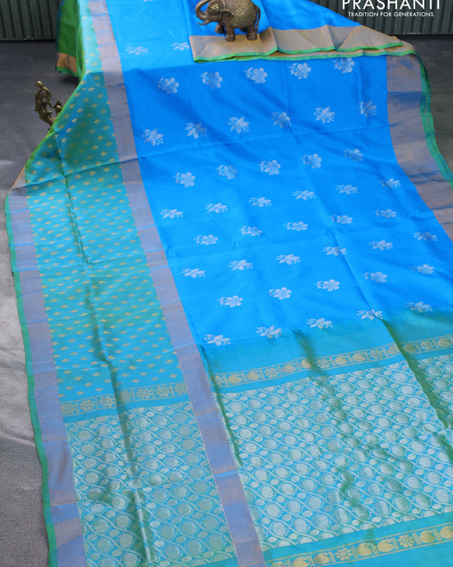 Pure uppada silk saree cs blue and dual shade of teal green with silver zari woven floral buttas and zari woven butta border