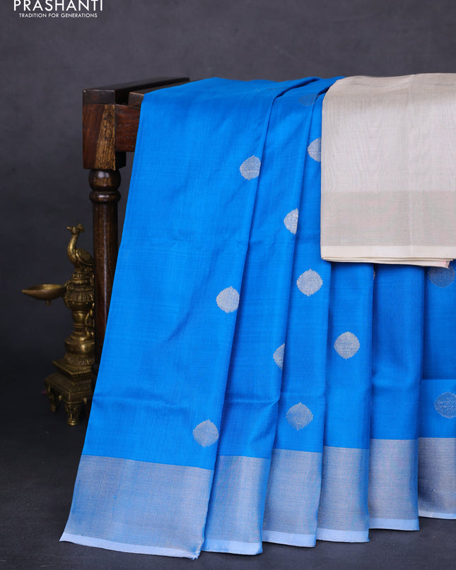 Pure uppada silk saree cs blue with silver zari woven coin buttas and silver zari woven border