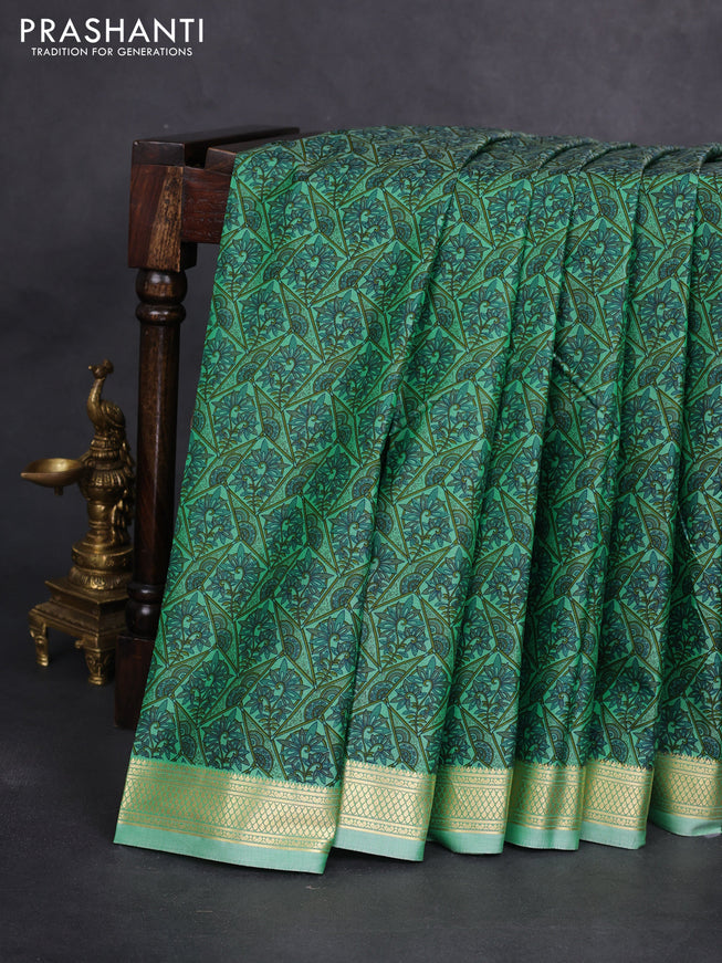 Printed silk saree pastel green with allover prints and zari woven border