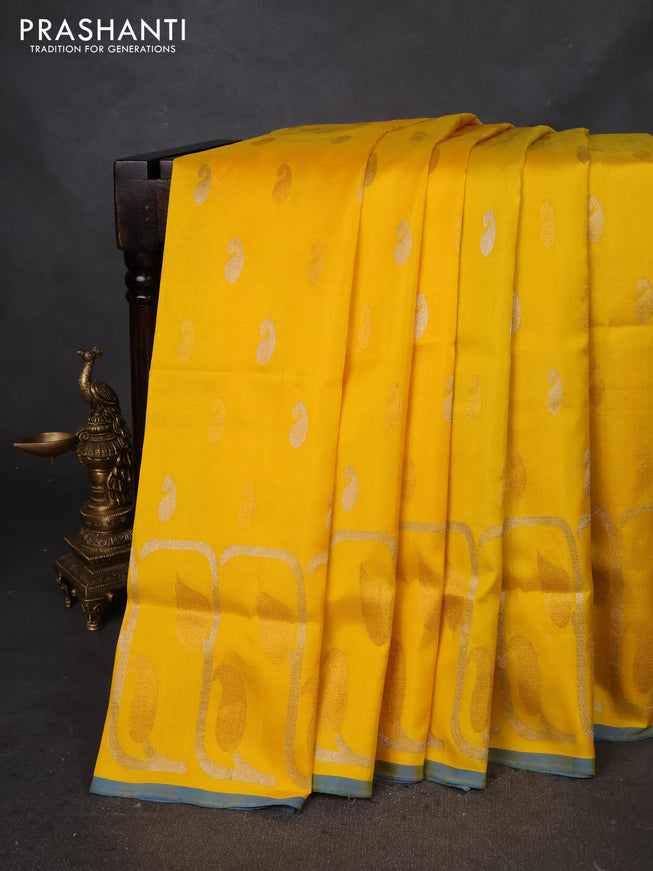 Pure uppada silk saree yellow and cs blue with silver & gold zari woven buttas and rich zari border
