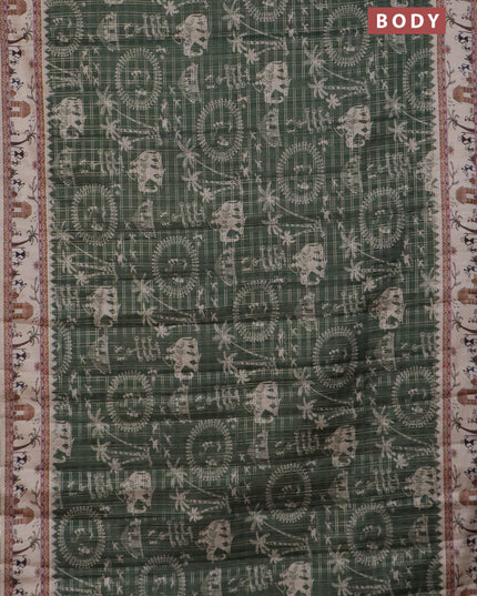 Semi tussar saree sap green and cream with allover zari checks & warli prints  and printed border