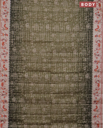 Semi tussar saree sap green and cream with allover zari checks & warli prints  and printed border
