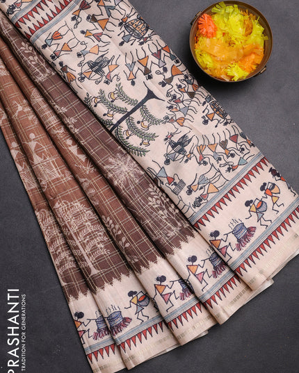 Semi tussar saree brown and cream with allover zari checks & warli prints  and printed border