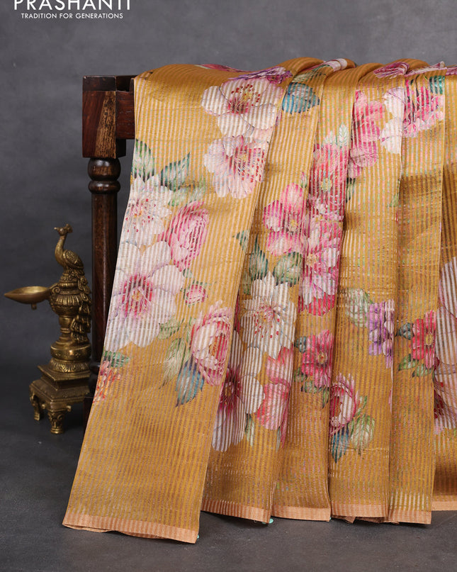 Pure organza silk saree dark mustard with floral digital prints & zari stripe pattern and zari woven piping border