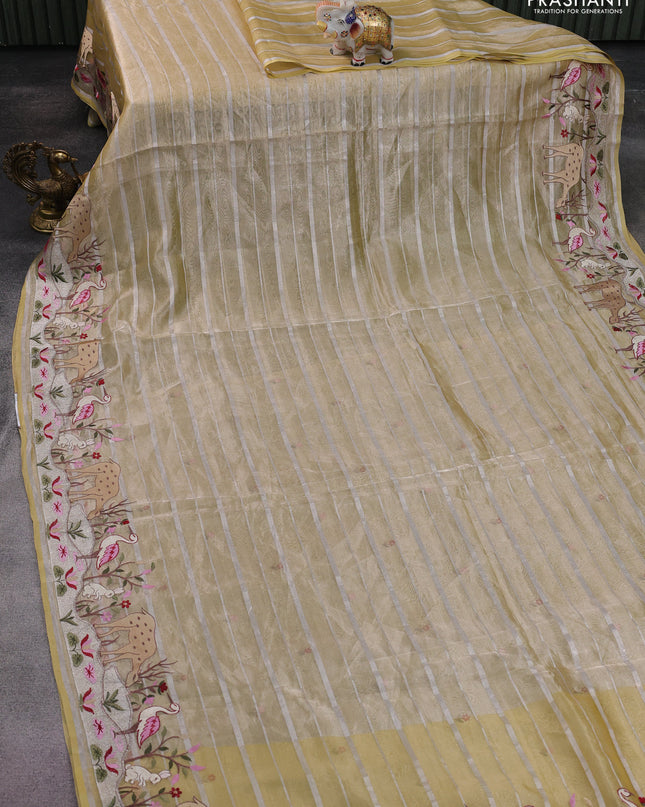 Pure tissue silk saree pale yellow with allover silver zari strip pattern & beaded work and embroidery border