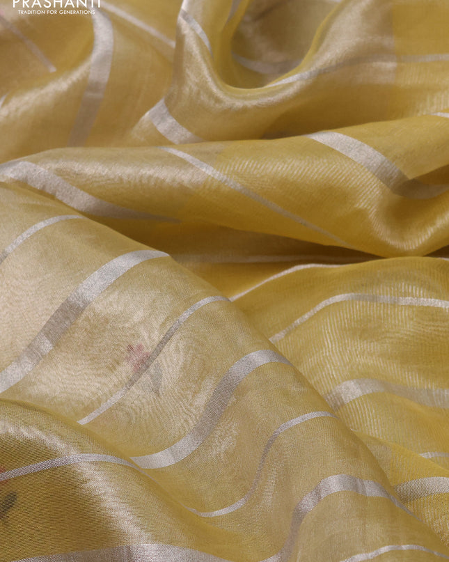 Pure tissue silk saree pale yellow with allover silver zari strip pattern & beaded work and embroidery border