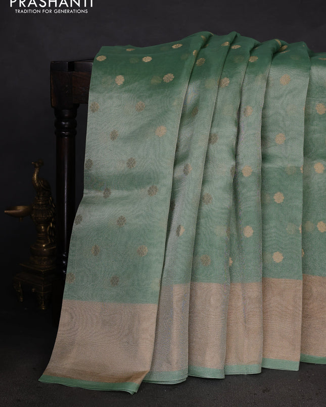 Pure tissue silk saree teal green shade with allover zari woven buttas and zari woven border