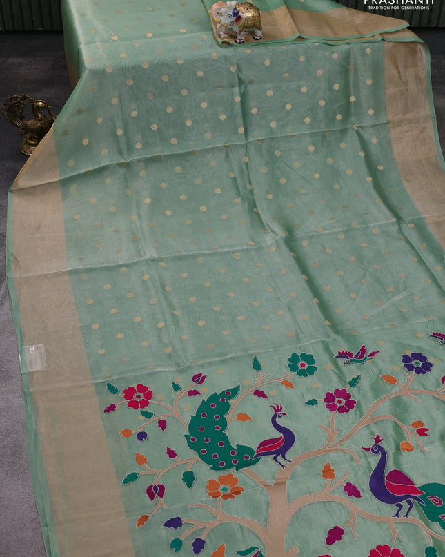 Pure tissue silk saree teal green shade with allover zari woven buttas and zari woven border