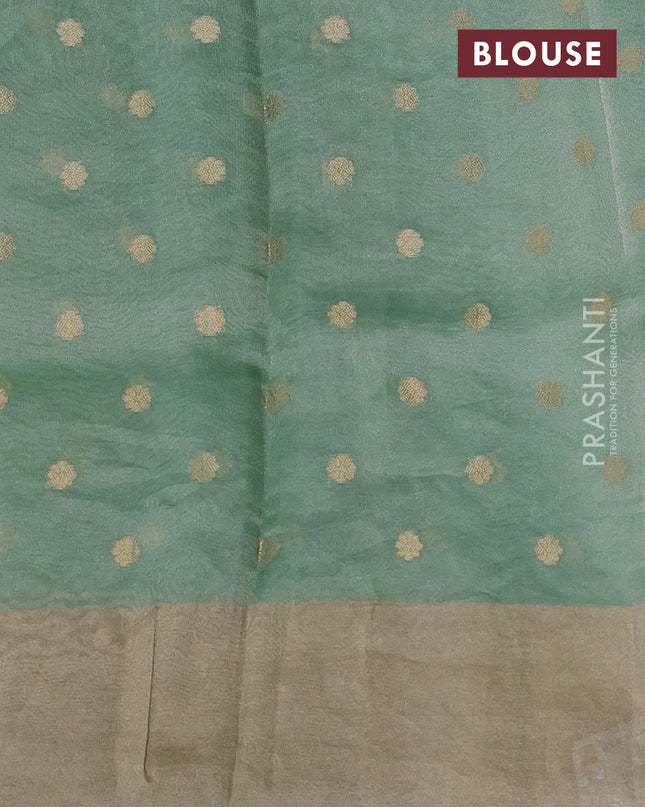 Pure tissue silk saree teal green shade with allover zari woven buttas and zari woven border