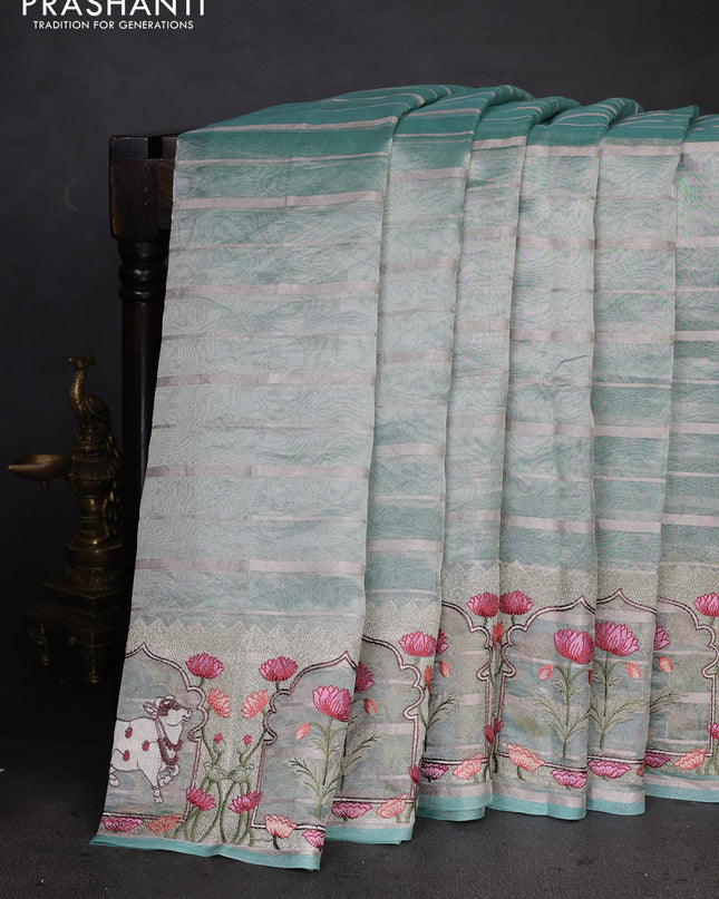 Pure tissue silk saree teal blue with allover silver zari strip pattern & beaded work and pichwai embroidery border
