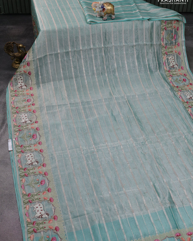 Pure tissue silk saree teal blue with allover silver zari strip pattern & beaded work and pichwai embroidery border