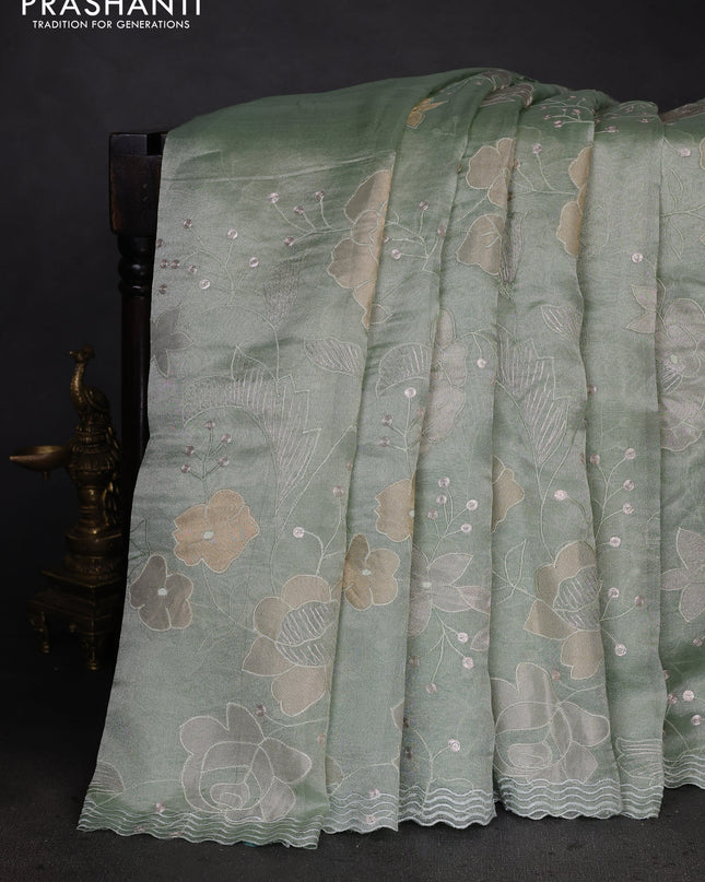 Pure tissue silk saree pastel green with allover floral embroidery work and simple embroidery border