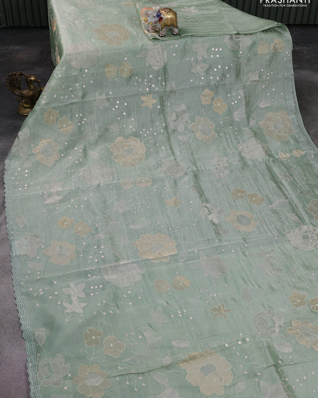 Pure tissue silk saree pastel green with allover floral embroidery work and simple embroidery border