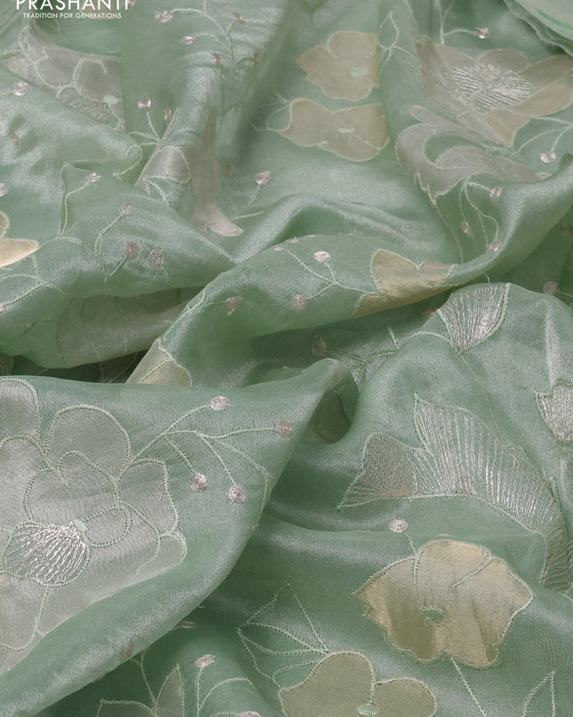 Pure tissue silk saree pastel green with allover floral embroidery work and simple embroidery border