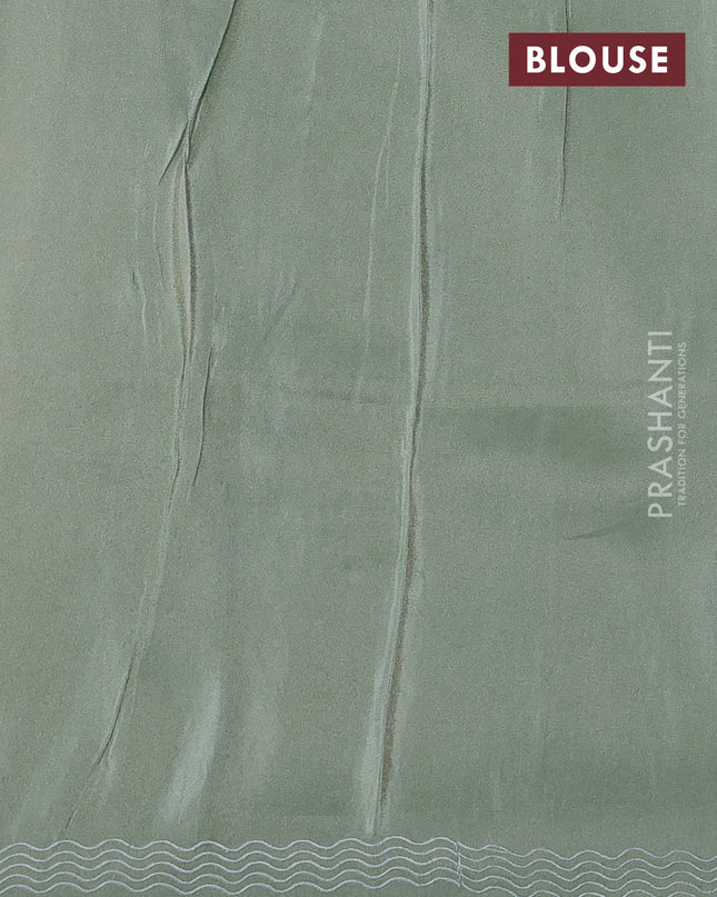 Pure tissue silk saree pastel green with allover floral embroidery work and simple embroidery border