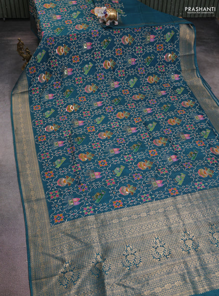 Crepe silk saree peaccock blue with allover mina weaves & sequin work and zari woven border