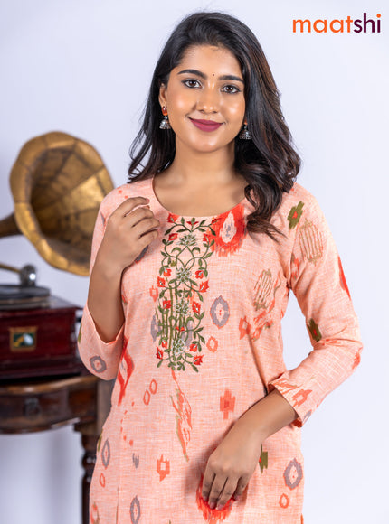 Cotton kurti set pale orange with allover ikat prints & embroidery work neck pattern and straight cut pant