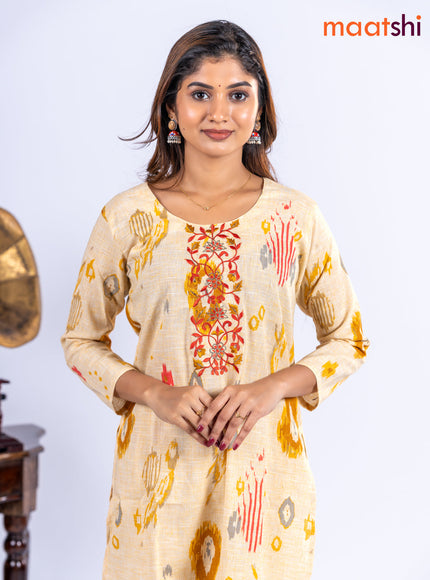 Cotton kurti set pale yellow with allover ikat prints & embroidery work neck pattern and straight cut pant