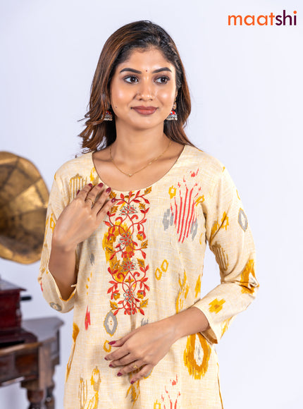 Cotton kurti set pale yellow with allover ikat prints & embroidery work neck pattern and straight cut pant