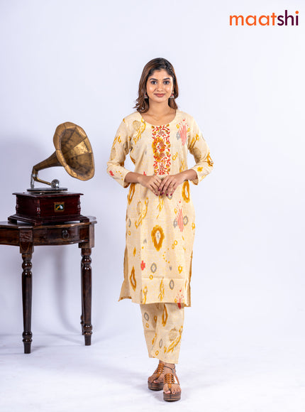 Cotton kurti set pale yellow with allover ikat prints & embroidery work neck pattern and straight cut pant