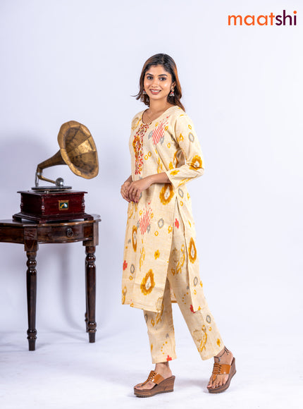 Cotton kurti set pale yellow with allover ikat prints & embroidery work neck pattern and straight cut pant