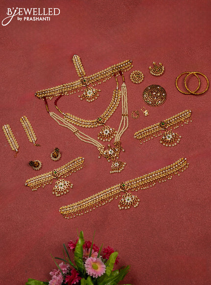 Bharathanatyam dance set with haaram,necklace,jhumka,hip belt,vanki,maang tikka,jada billai,maatal,bullaku,bangles and kemp stones & pearl hangings