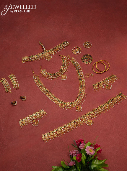 Bharathanatyam dance set with haaram,necklace,jhumka,hip belt,vanki,maang tikka,jada billai,maatal,bullaku,bangles and kemp stones & pearl hangings