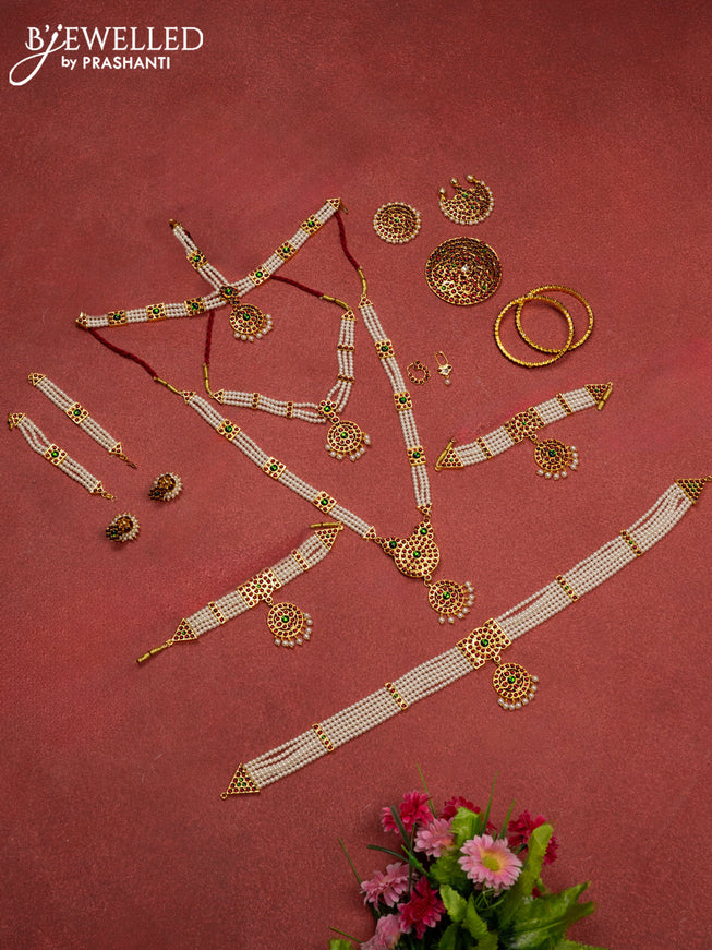 Bharathanatyam dance set with haaram,necklace,jhumka,hip belt,vanki,maang tikka,jada billai,maatal,bullaku,bangles and kemp stones & pearl hangings